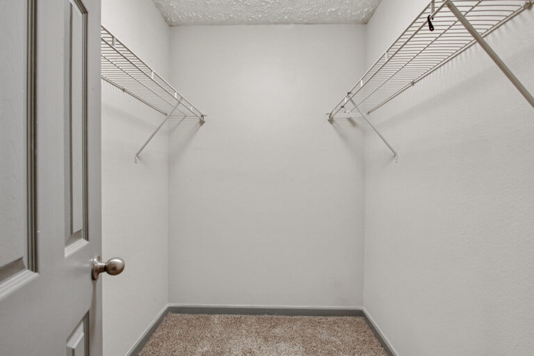 large, oversize closet with white wire shelving