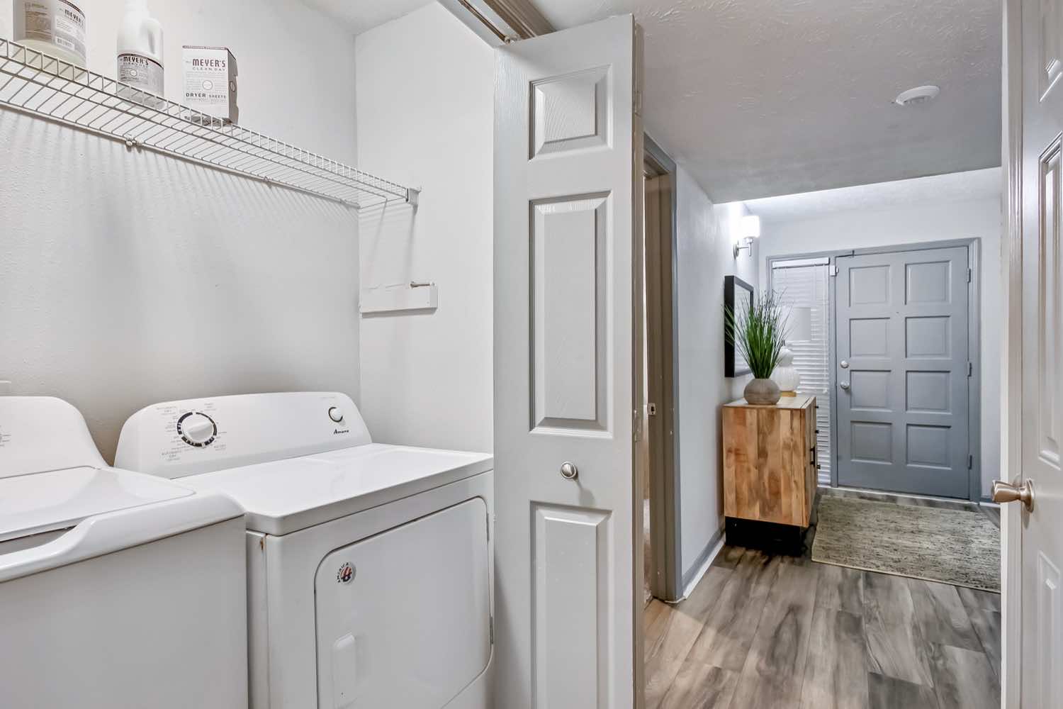 entry way with washer and dryer in laundry room