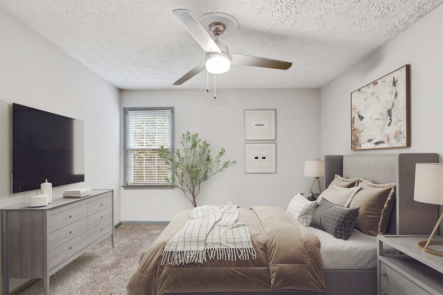 model bedroom with wood-style flooring and ceiling fan