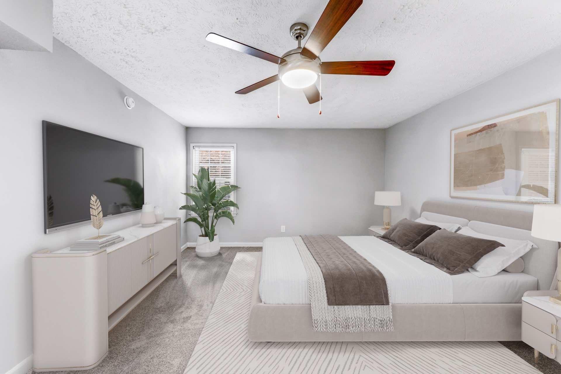 spacious bedroom with ceiling fan